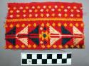 Brocaded weft fragment; red cotton base; blue, white & yellow cotton brocading