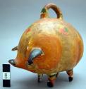 Small pottery pig with coin slot (piggy bank)