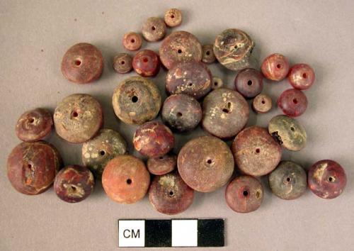 Disk-shaped amber beads of various sizes