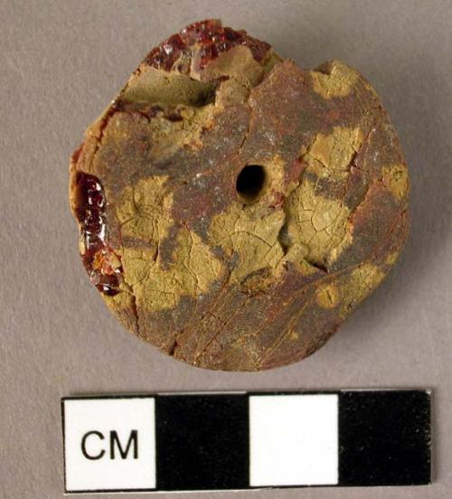 Disk-shaped amber pendant, double-drilled