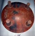 Carved wooden bowl, large, shallow, 4 legs, perforated knob on bottom.