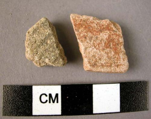 Ceramic rim and body sherd, traces of red and black slip