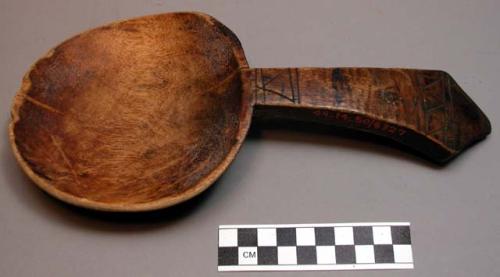 Wooden spoon for removing food from pot. Chikowe