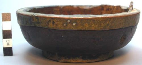 Carved wooden bowl with metal rim