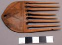Small wooden comb, 8 tines, no handle, incised, mapasuli