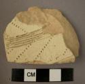 Ceramic body sherd, thick, white slipped buff ware, incised and punctate design