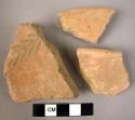 Ceramic rim and body sherds, red ware, 1 sherd with impressed floral design