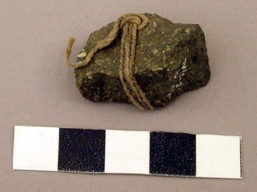 Raw material, unmodified rock tied with twine