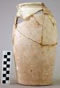 Almost complete vessel of whitish clay and incised decoration plus 3 sherds