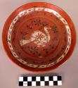 Redware plate with bird motif