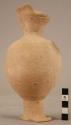 Trefoil mouth pottery jar with narrow elongated neck and narrow elongated hollow