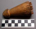 Head scratcher, bottle shaped piece of wood with sharp pegs inserted in base (nt