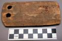 Unclassified, wood object, flat, rectangular, 2 perfs at 1 end, worn 1 side