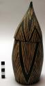Wooden box - torpedo shape, incised linear pattern in black and white ("agakongo
