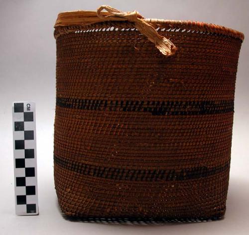 Basket, coiled weave, cylindrical in shape, 2 black stripes, kakabu