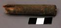 Worked stick, broken, cylindrical, traces of pigment, feather fragment inserted