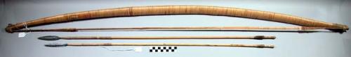 Bow, wood shaft, reed bowstring, both fiber wrapped, fiber bowstring end ties