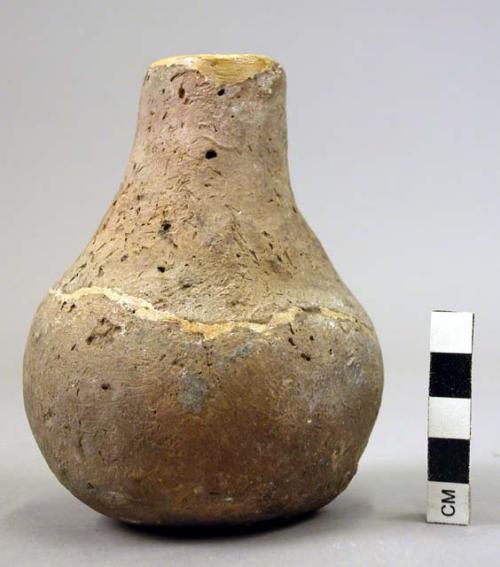 Small handleless pottery jug