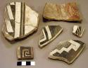 Ceramic rim and body sherds, red on white, black on white, geometric, mended