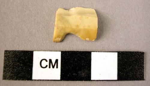 Stone blade fragment with lateral notches