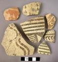 Ceramic rim and body sherds, white ware with brown painted linear design