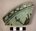 Rim potsherd -  black and green glazed