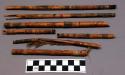 Reed arrow shafts, pigmented deco, sinew wrapped, feather fragments, nocks