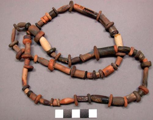 String of terracotta beads in disc and cylindrical shapes