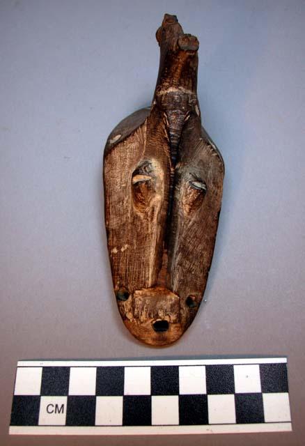 Wooden mask, brown patine with single horn; rare shape and design