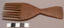 Comb - wood, "hour-glass" shaped handle, 8 tines (mapasuli)
