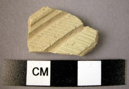 Ceramic rim sherd, fine white ware, wheel made, incised decoration