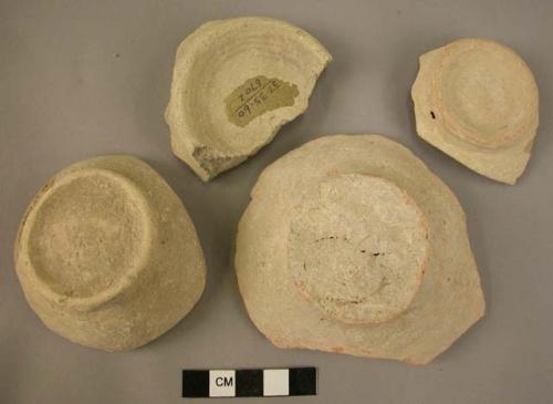 4 pottery jar bases