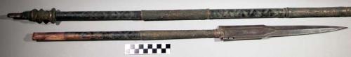 Spear, partial, pointed metal blade, wood shaft with ponted floral design