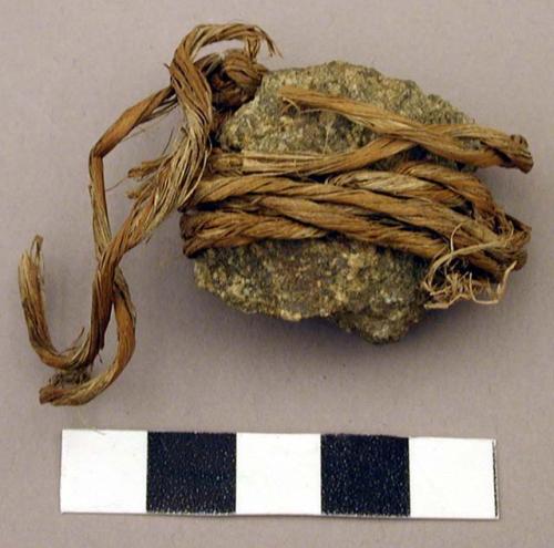 Raw material, unmodified rock tied with twine