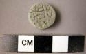 Small round inscribed stone seal