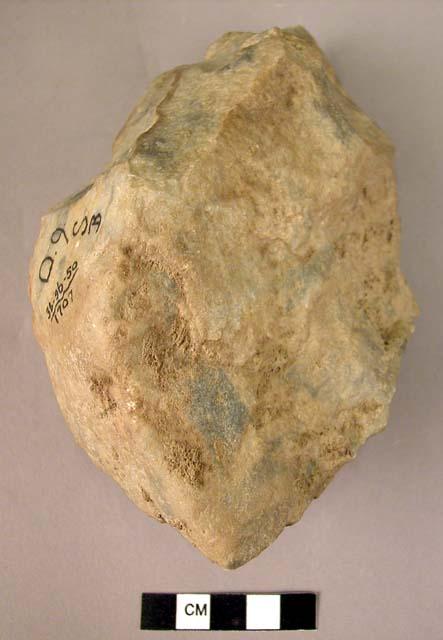 Large coarsely worked quartzite fist axe with cortex adhering to the butt end