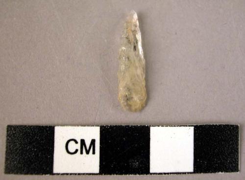 Small quartz microlithic point of Gravette type, with steeply retouched back