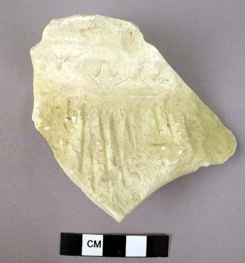 1 buff sherd with incised decoration