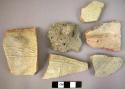 12 potsherds with incised or impressed decoration