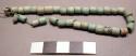 String of beads, faince; pottery base