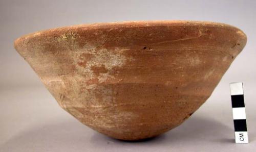 Bowl of smooth red brown ware, red painted