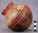 Spherical pot, red ware, with black and white geometric/linear designs.