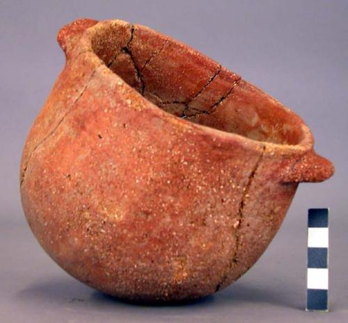 Small pottery vessel - coarse tempered, lug handles, glaze surface (restored)