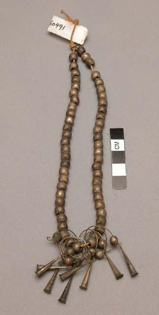 Necklace, possibly Plains. 54 brass beads with 9 tin rings and tinklers.
