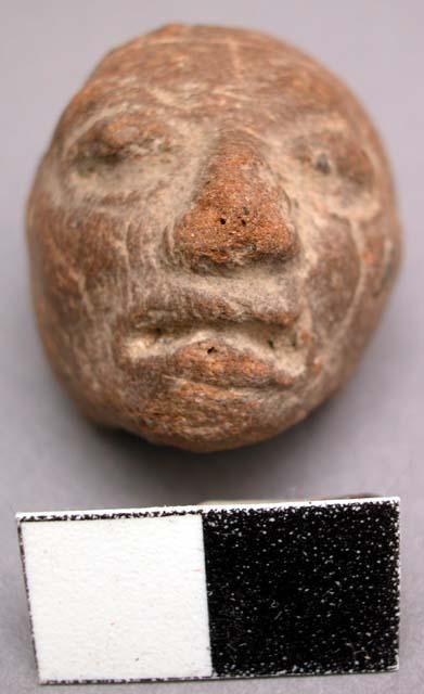 Earless pottery head made from mold. Classic Maya Features. Height: 3.1 cm.