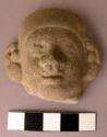 Clay figurine fragment - face