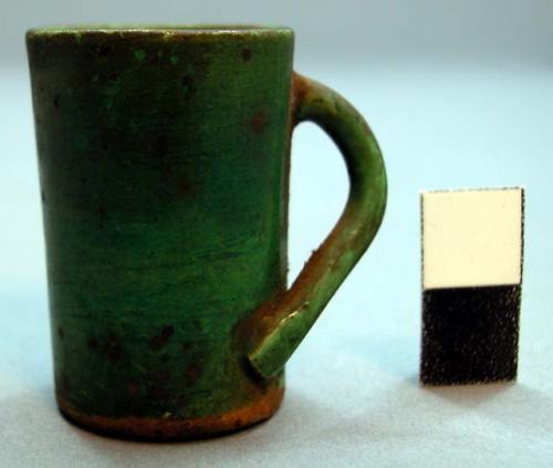 Miniature handled mug, green glazed ceramic