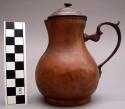 Lidded copper alloy pitcher with flaired base- miniature.