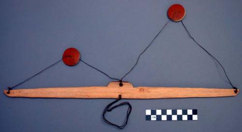 3 wooden discs on a cord - puzzle (toy)