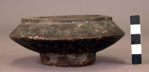 Black pottery dish 4 1/2" d x 1 3/4" h.